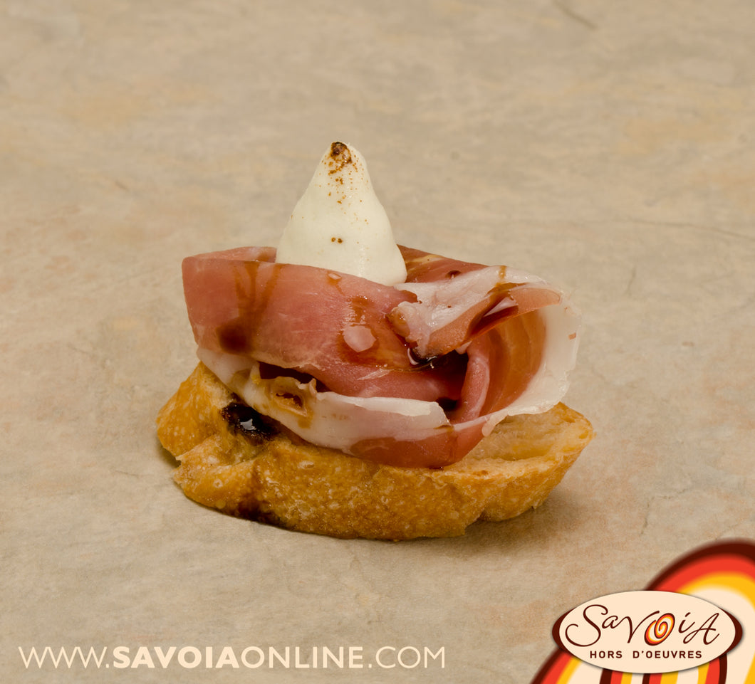 Prosciutto on Crostino with Goat Cheese Pearl